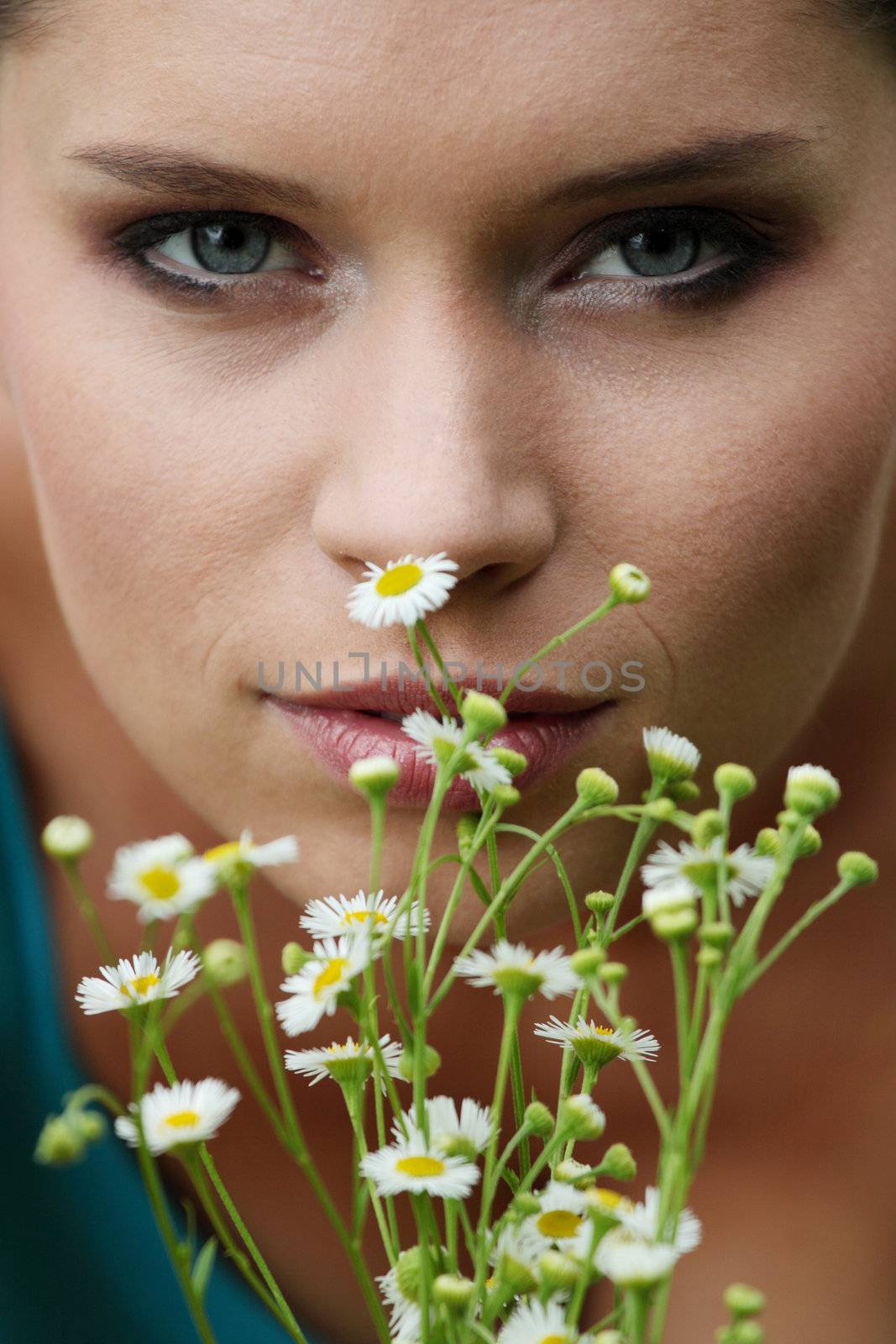 Beautiful young woman relaxing in the grass