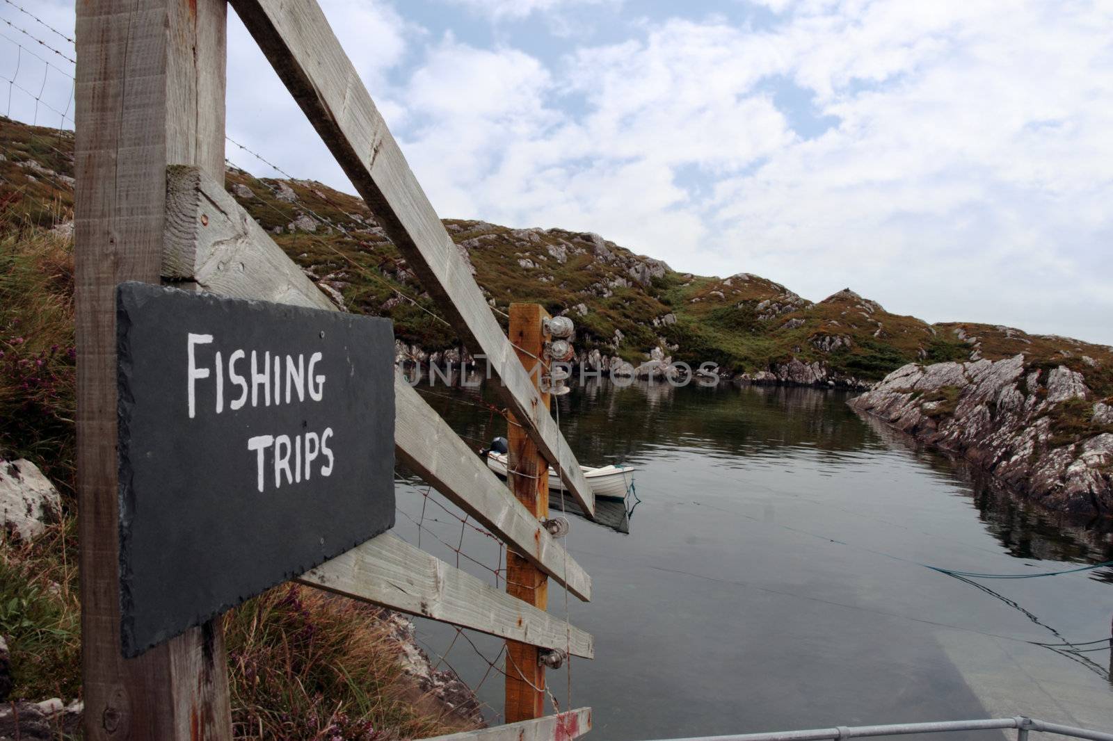fishing trips sign at a bay with scenic view in county kerry ireland