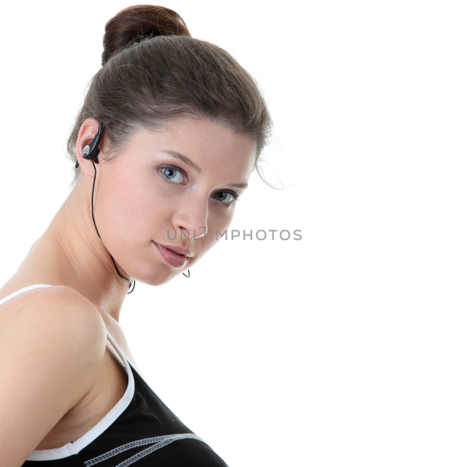 Young fitness woman with sport headphones listening music