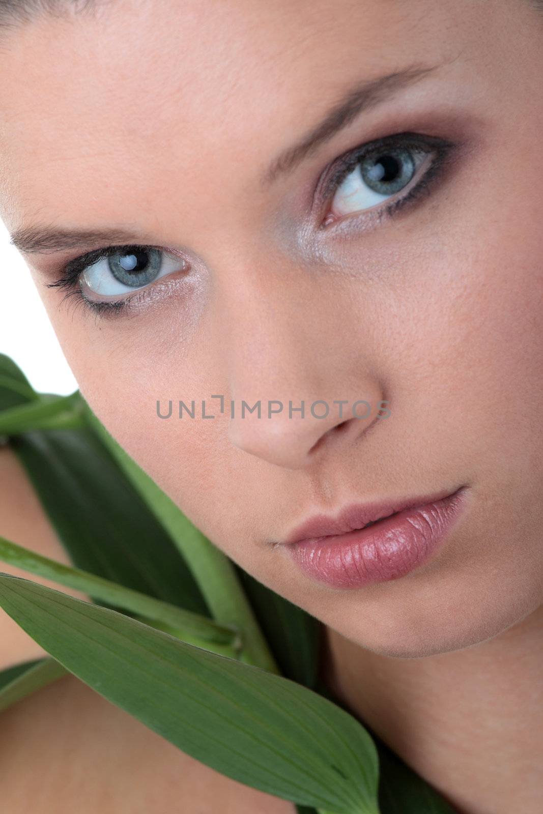Portrait of Fresh and Beautiful woman with flower isolated on white