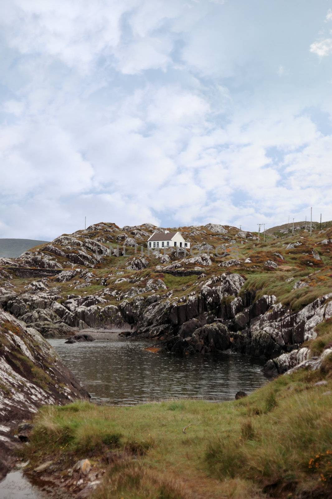 scenic view of a holiday home among the rocky lanscape in kerry ireland