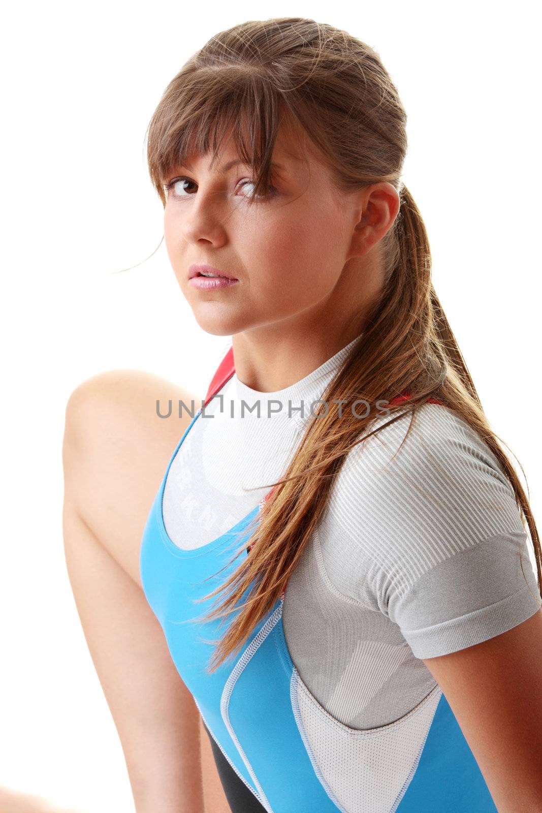 Young woman in rowing suit isolated