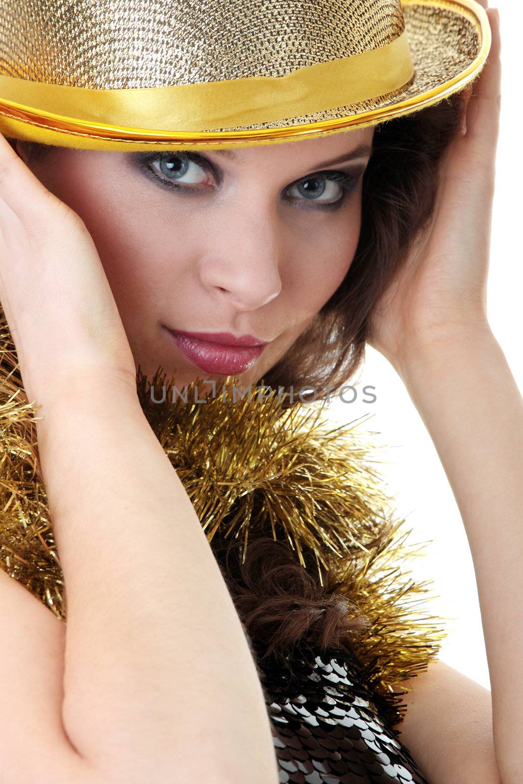 Young beautiful caucasian woman in black elegant party dress and gold hat