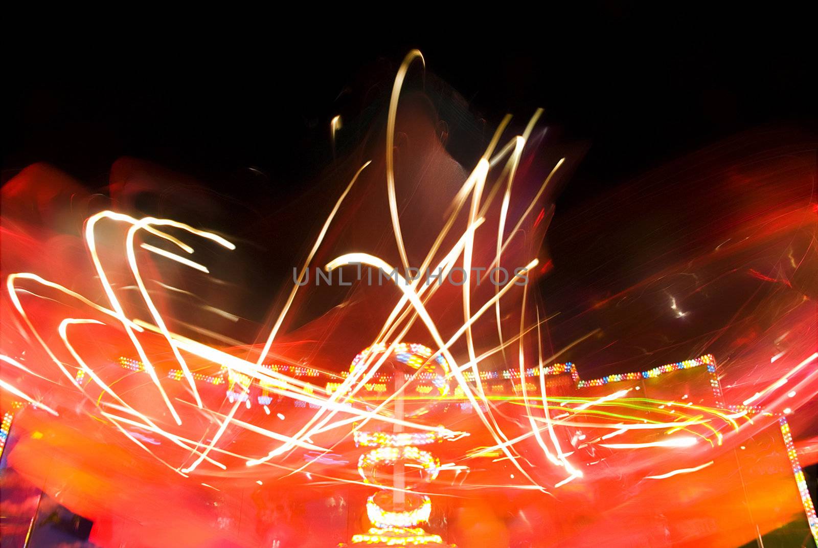 Blur neon lights in amusement park, long exposure