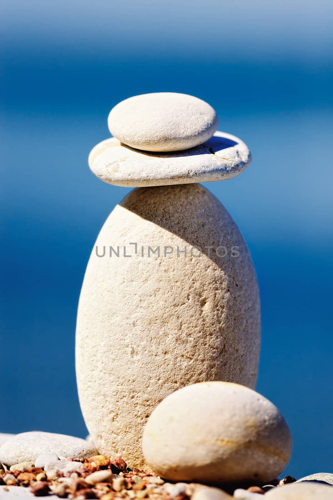 Round pebbles on top of a long cobblestone