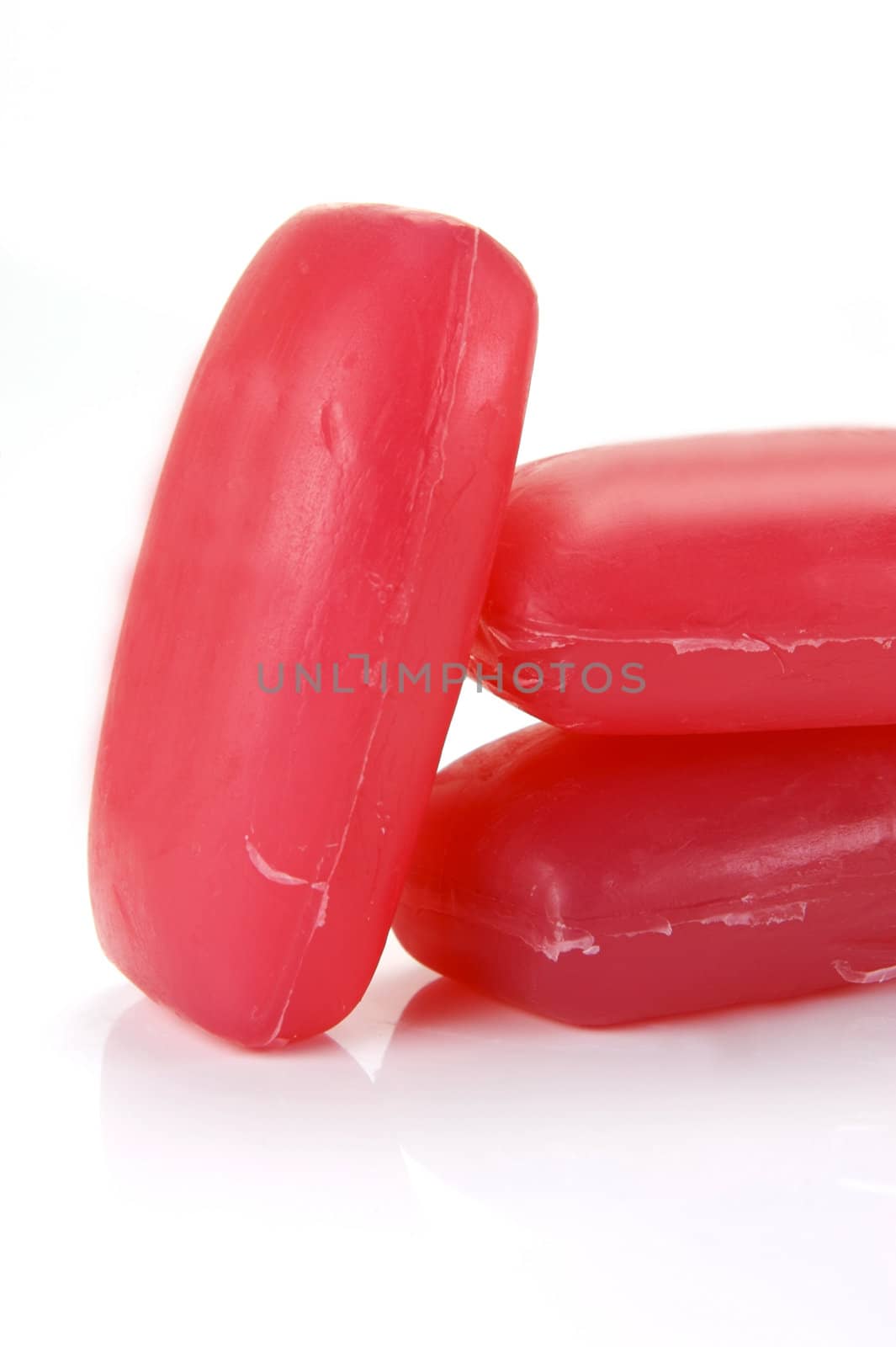 Bars of raspberry soap isolated against a white background