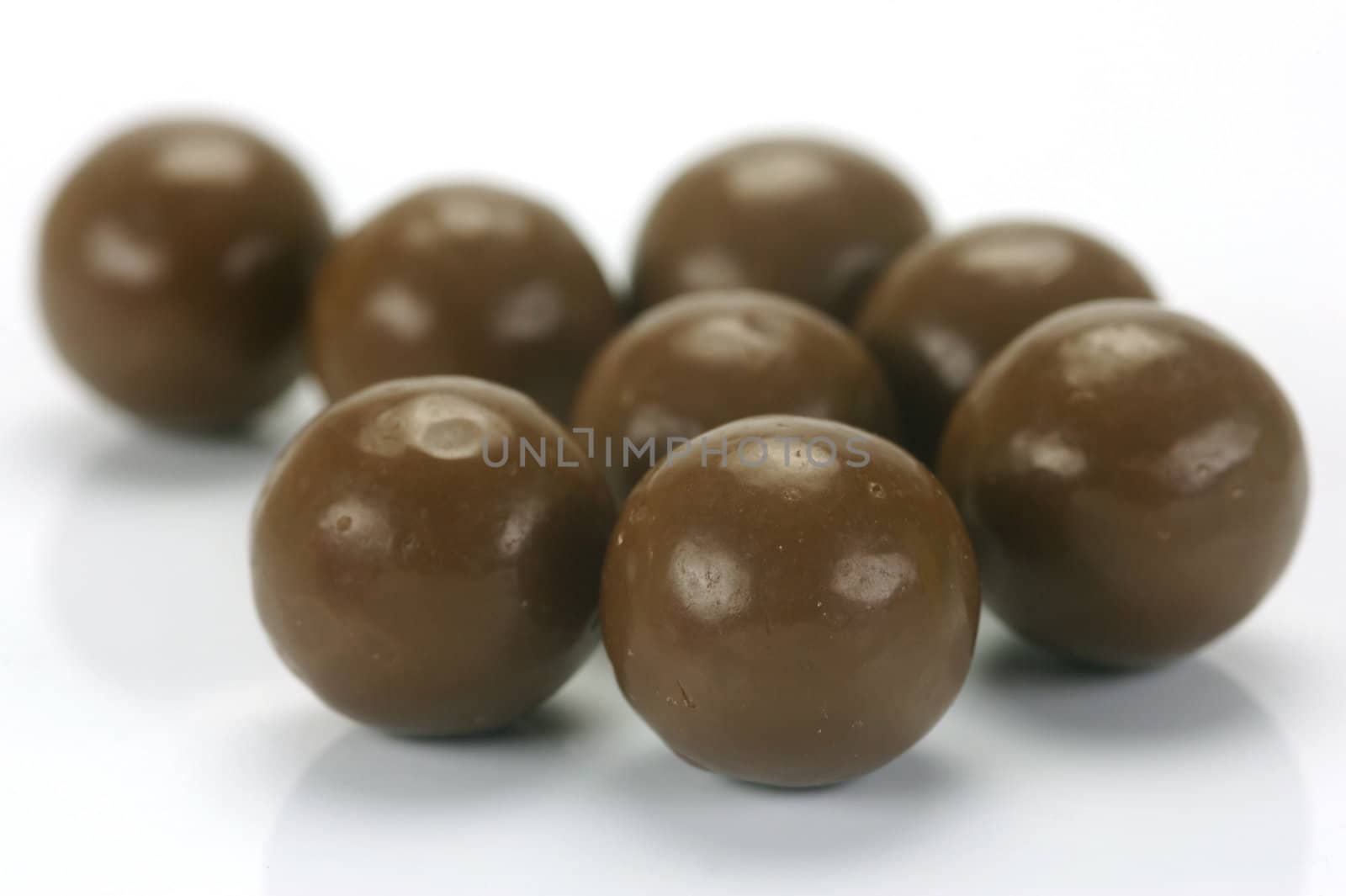 Chocolate balls isolated against a white background