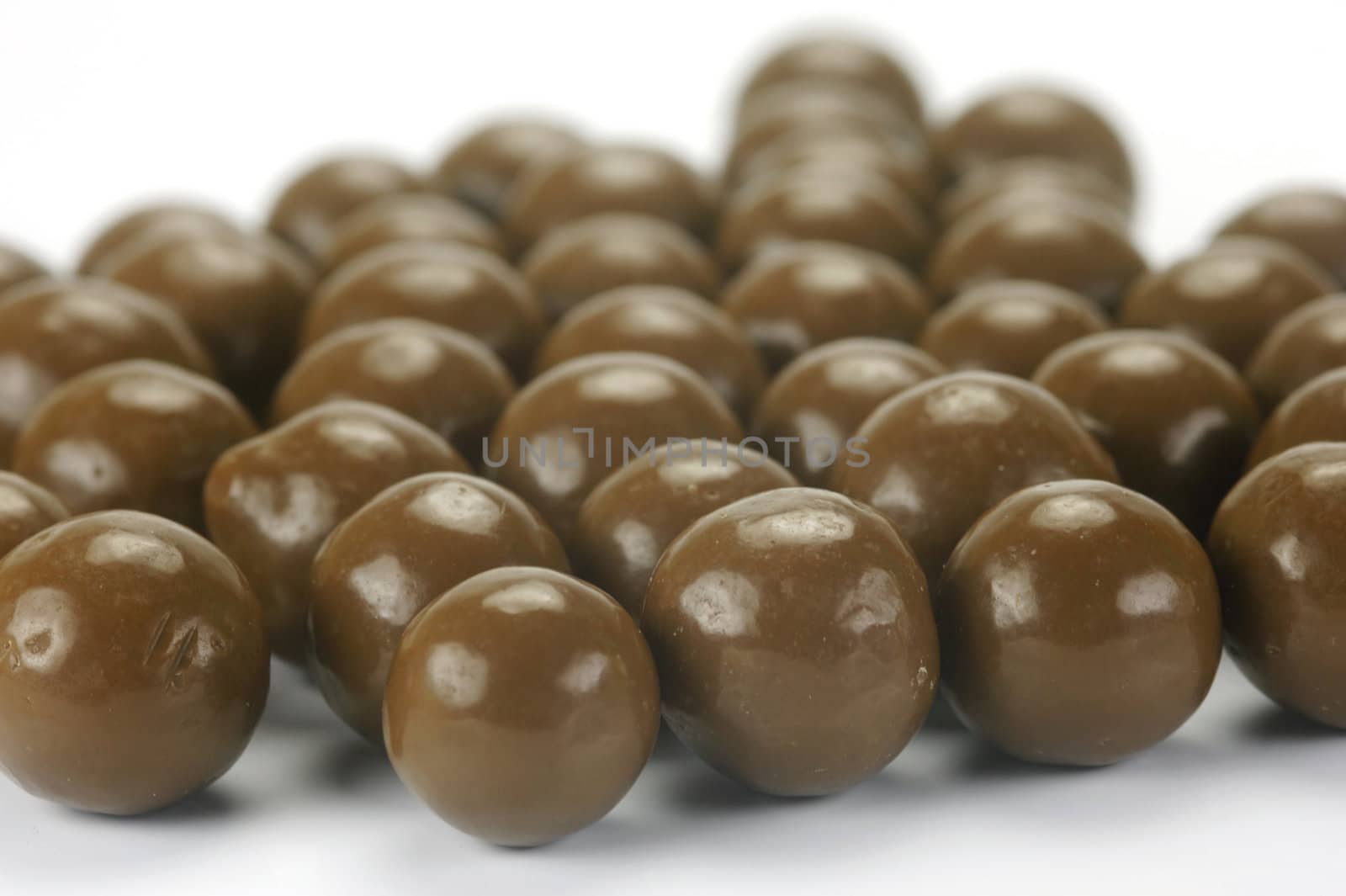 Chocolate balls isolated against a white background