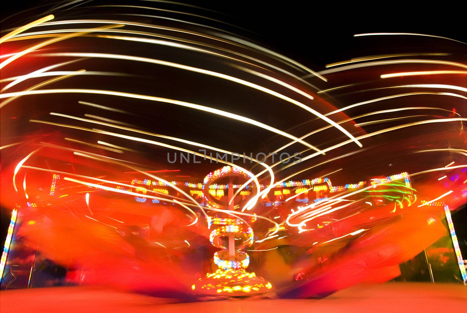 Blur neon lights in amusement park, long exposure