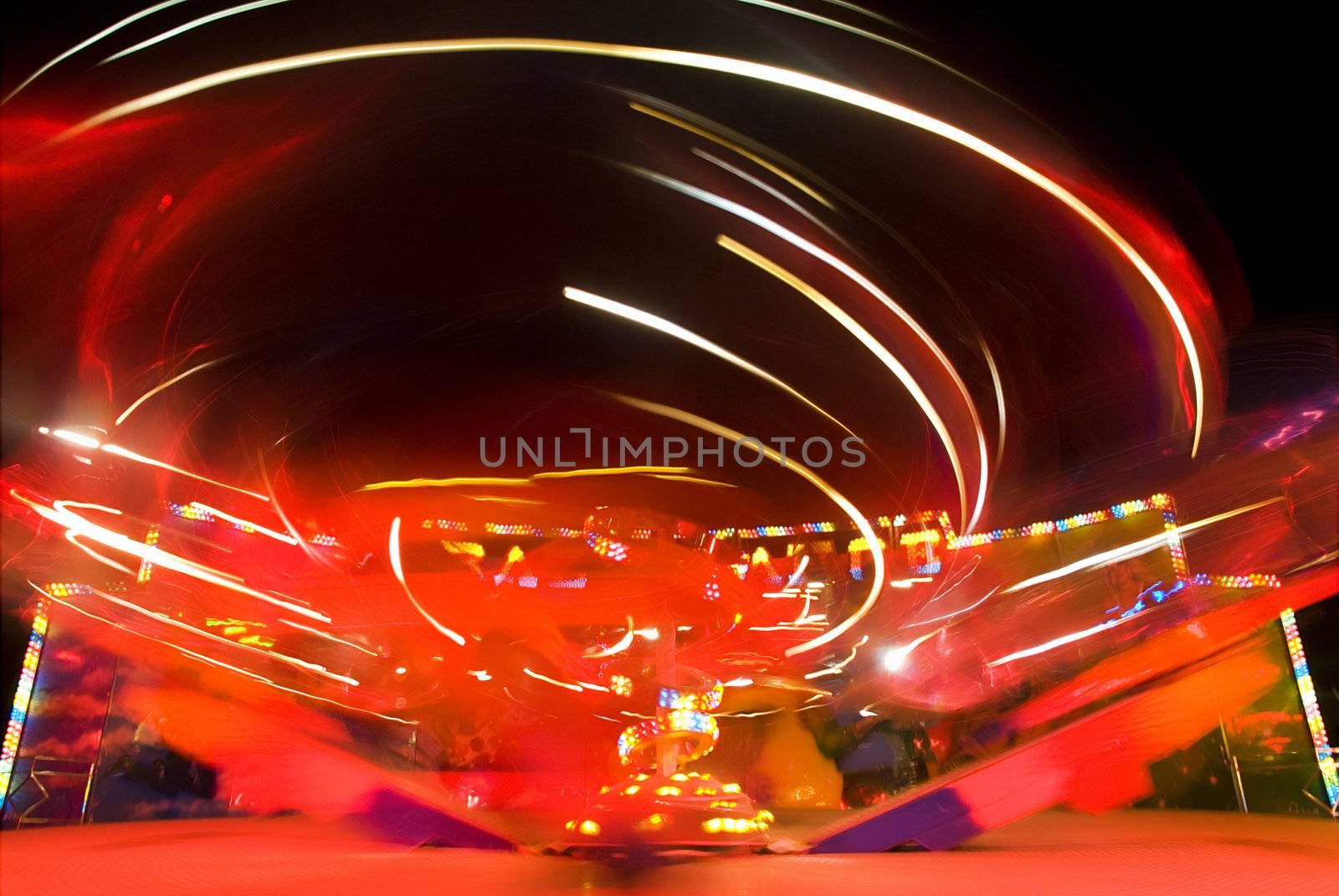 Blur neon lights in amusement park, long exposure