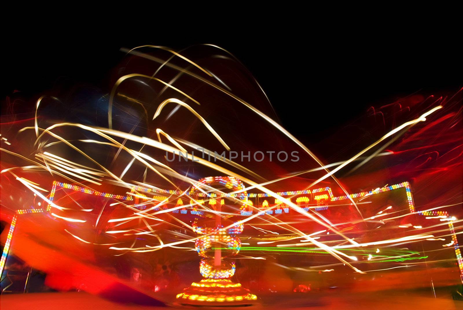 Blur neon lights in amusement park, long exposure