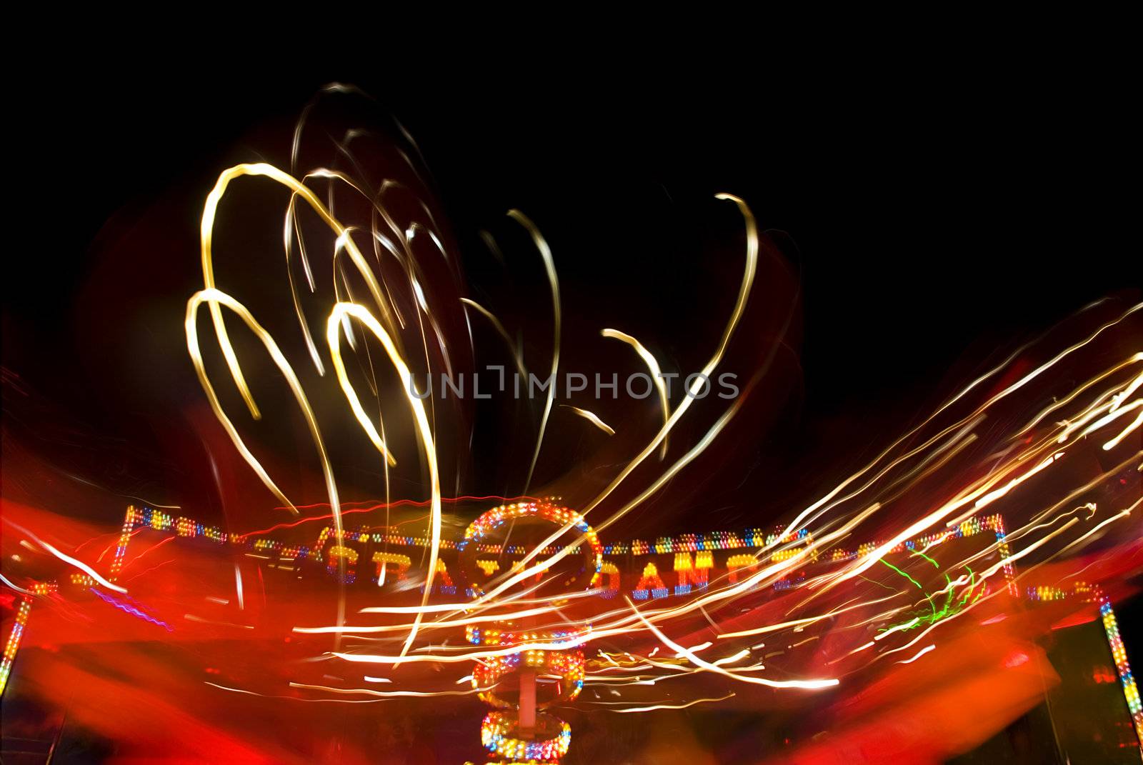 Blur neon lights in amusement park, long exposure