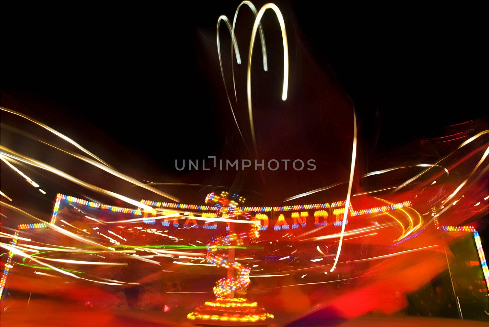 Blur neon lights in amusement park, long exposure