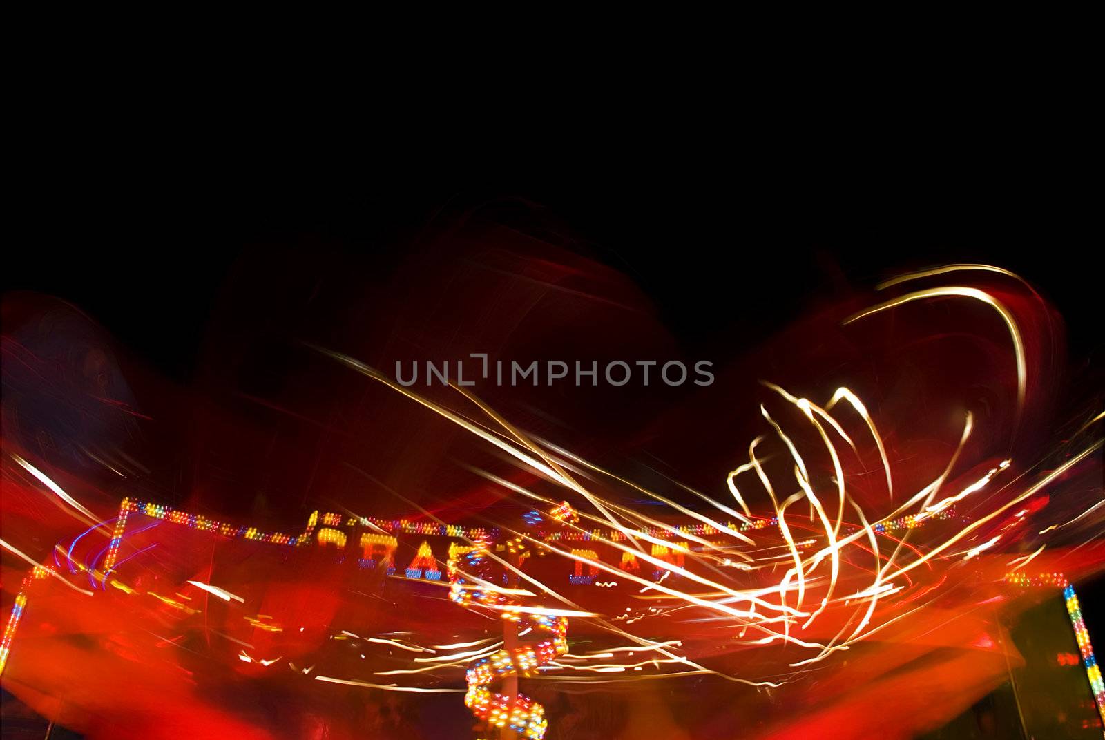 Blur neon lights in amusement park, long exposure