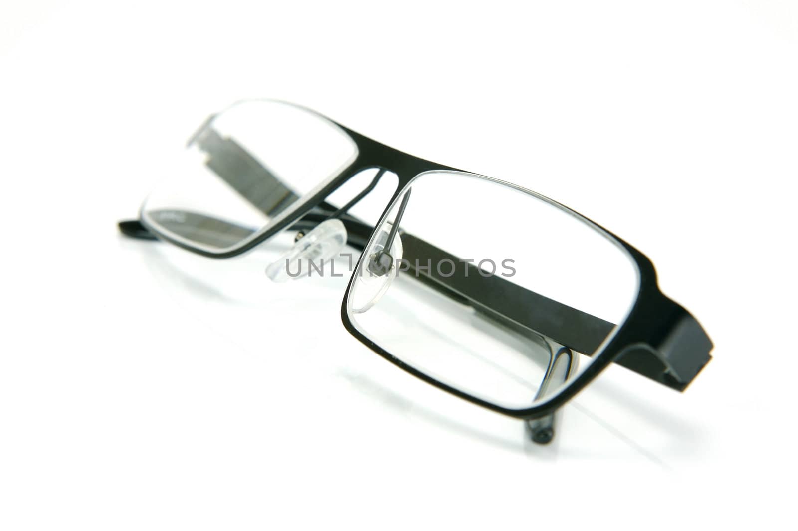 A pair of reading glasses isolated against a white background