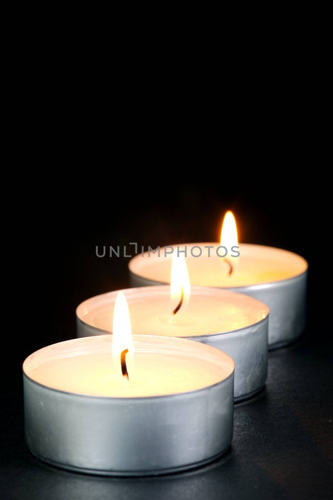 Scented candals isolated against a black background