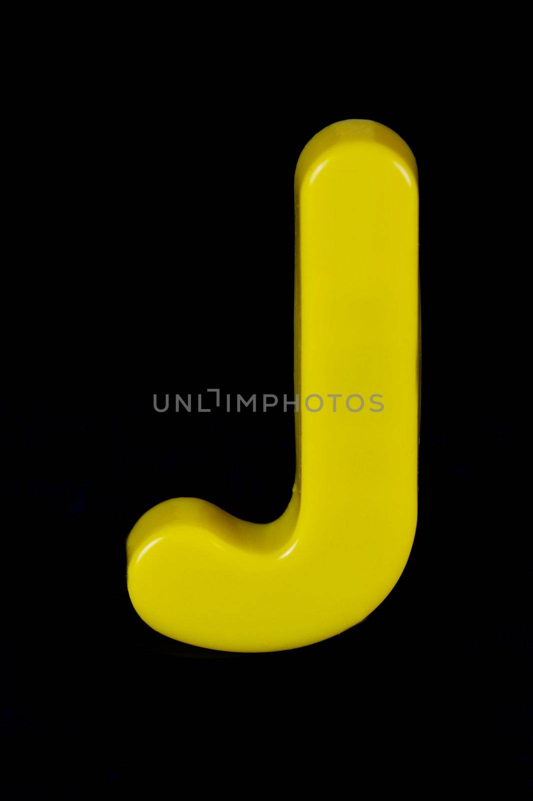 Letters of the alphabet isolated against a black background