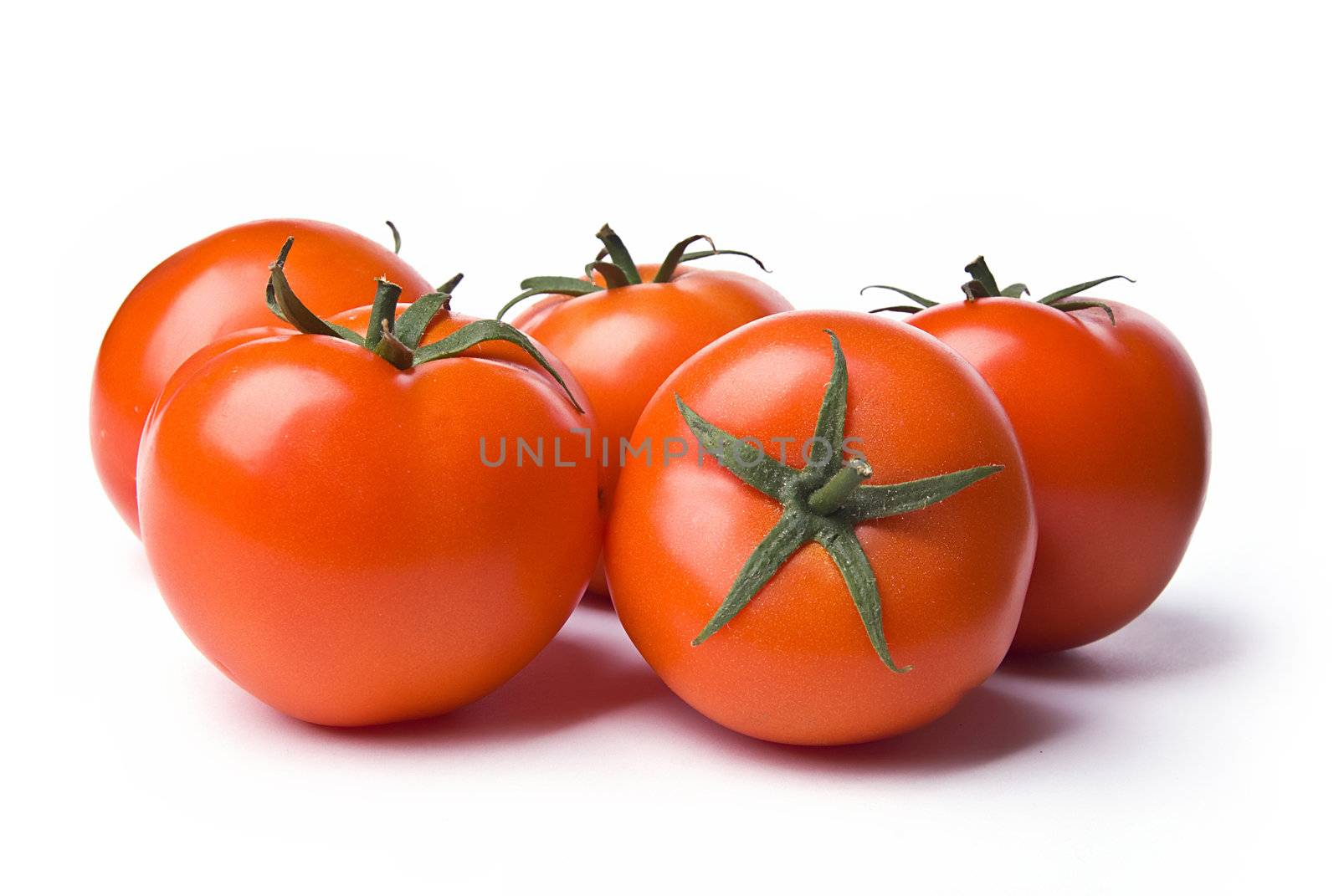 Group of red tomatos on white background