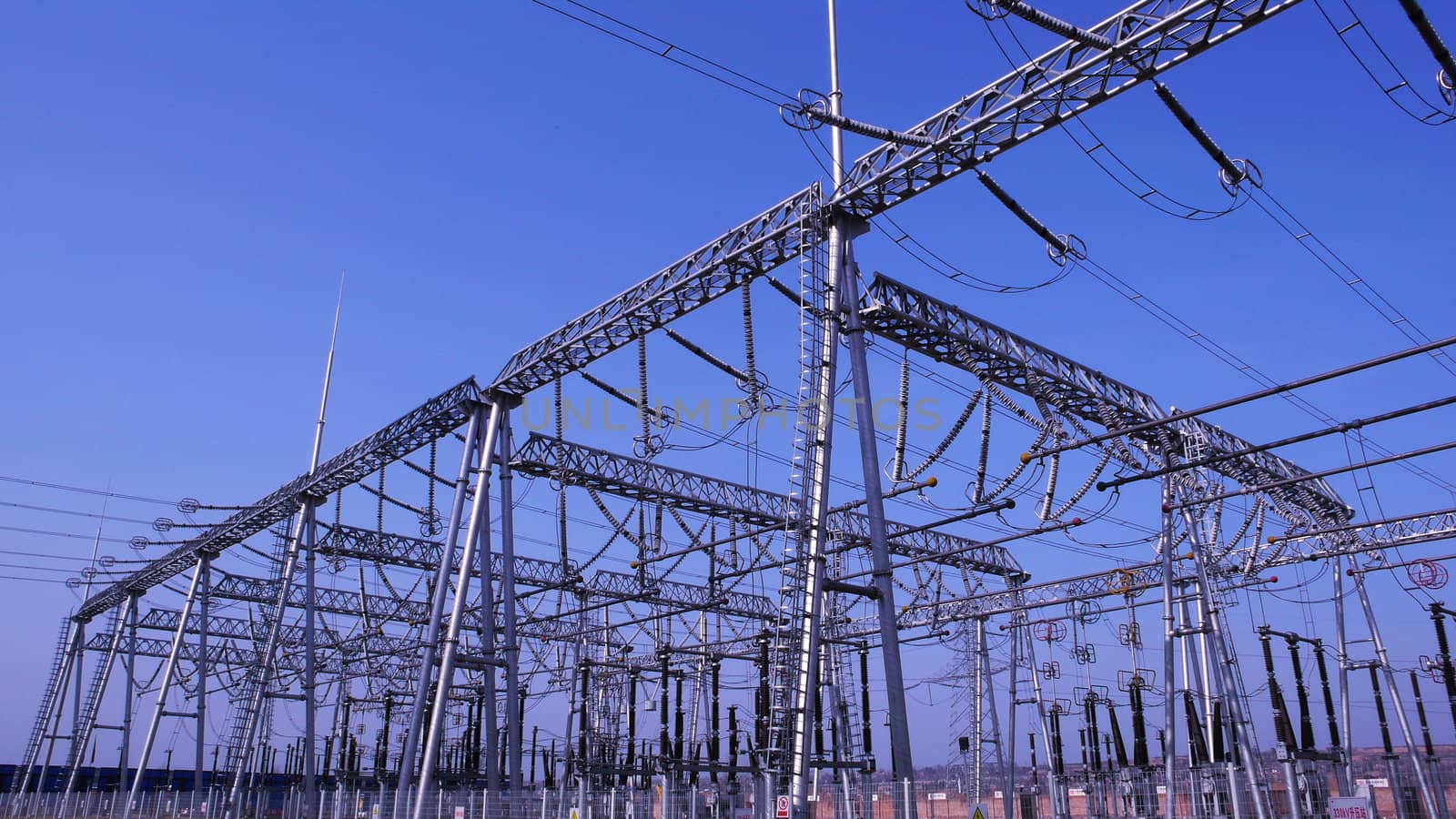 View of the high voltage transmission lines in a heat power plant