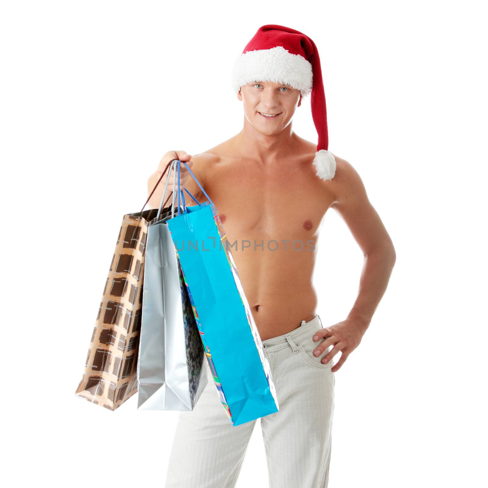 Sexy muscular shirtless man in Santa Claus hat by BDS