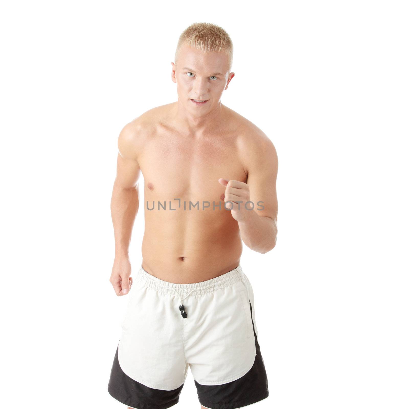 Sexy muscular man exercising isolated on white