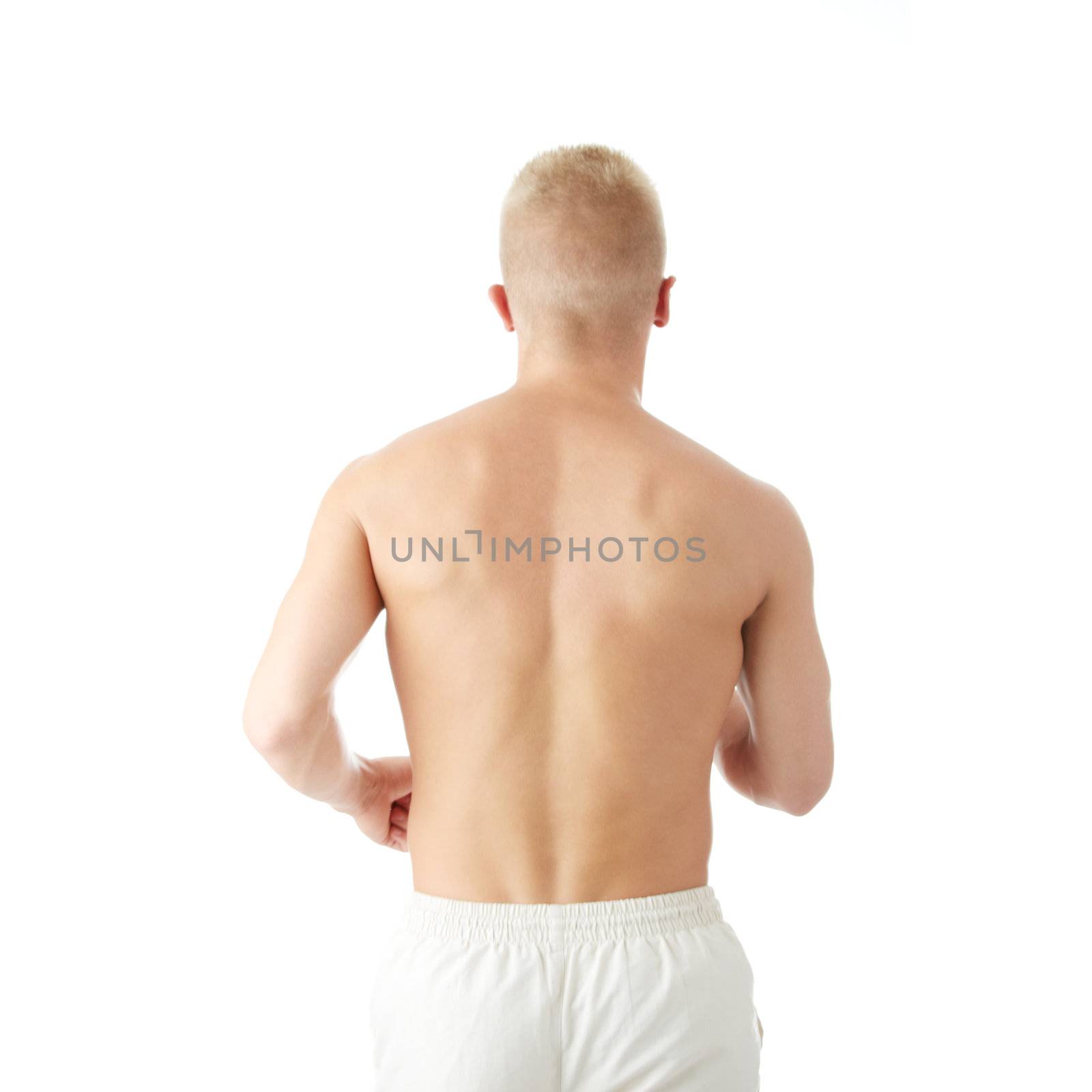 Sexy muscular man exercising isolated on white
