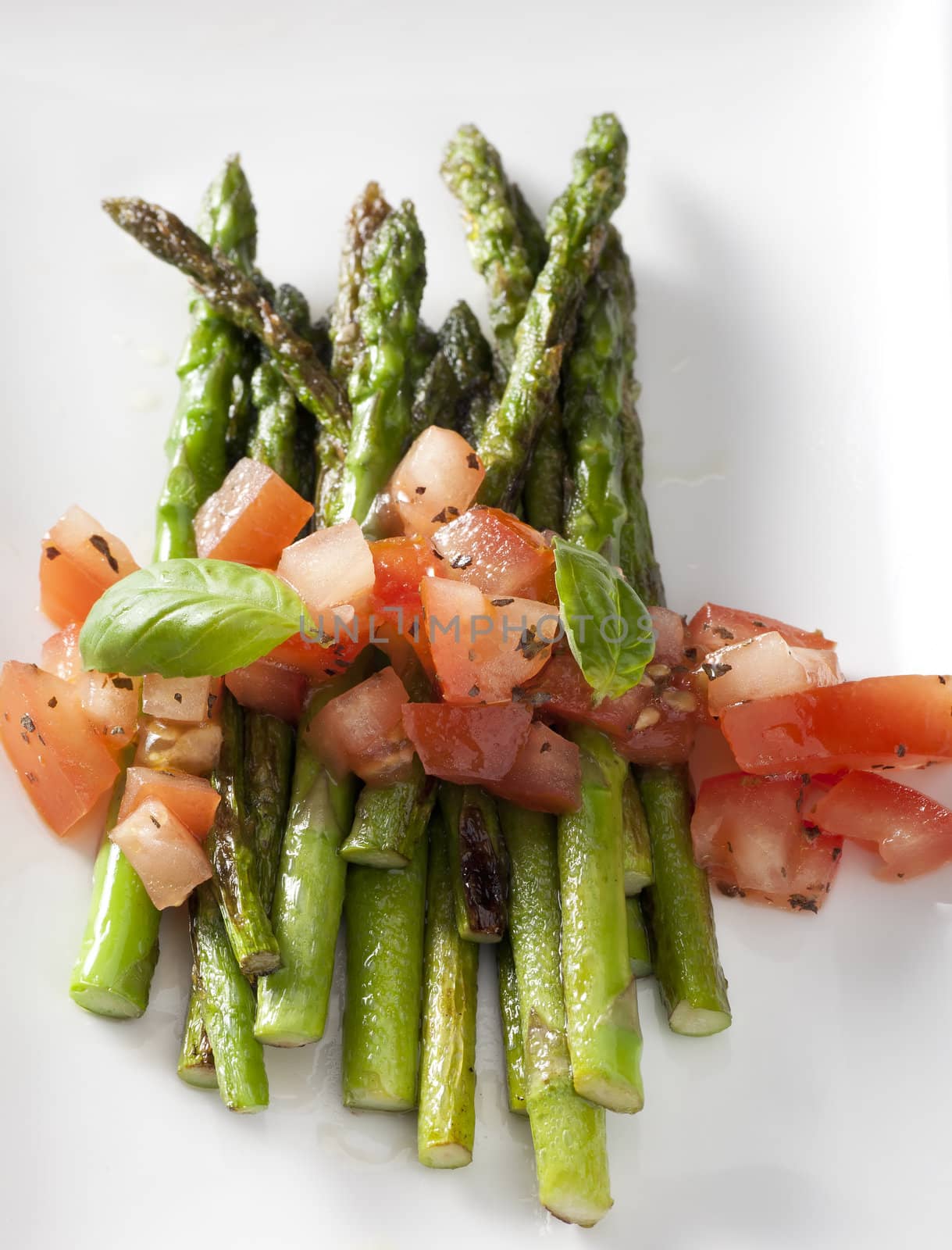 Fresh grilled asparagus topped with a tomato basil salsa