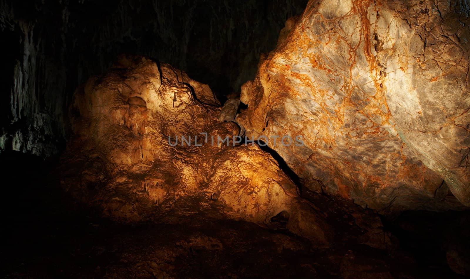 The amber rock in a cave (light painting)