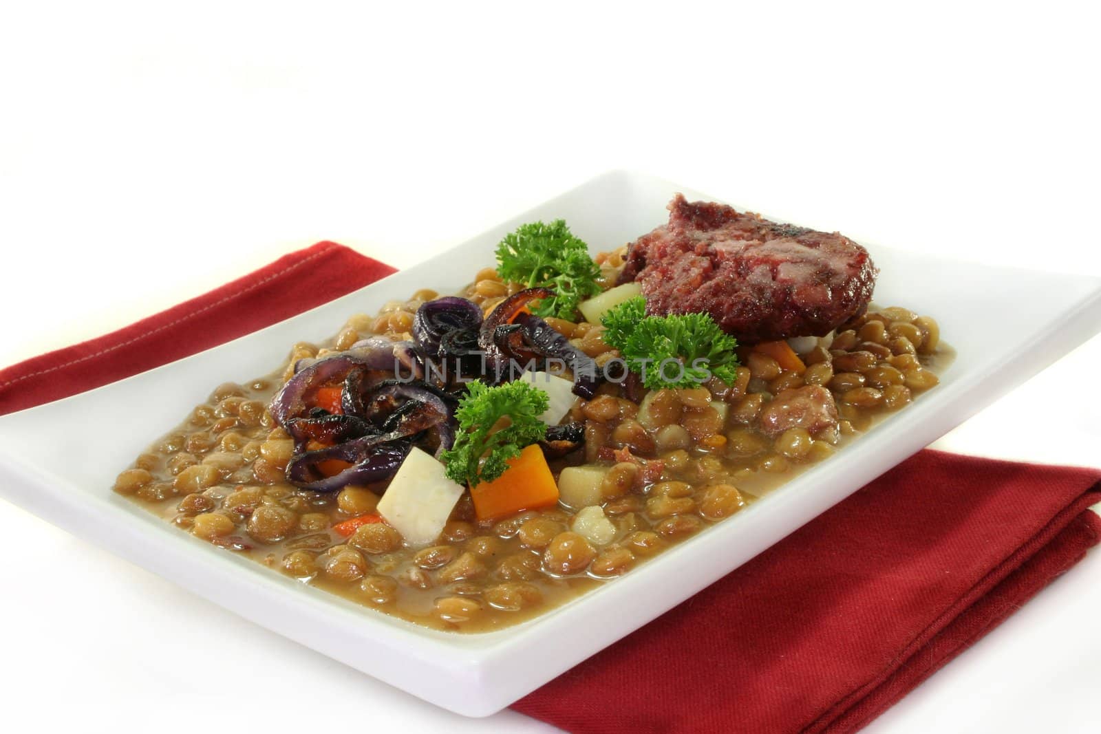 Lentil dish with roasted onion and black pudding