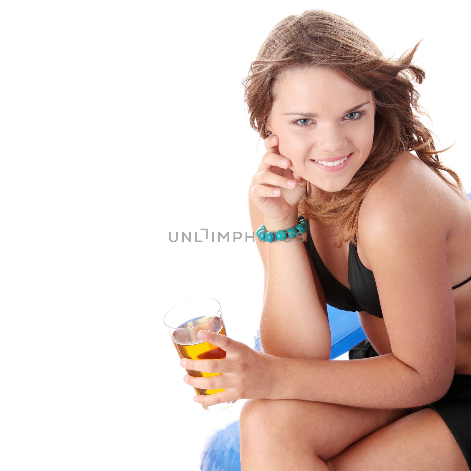 Young woman in bikini drinking ice tea isolated