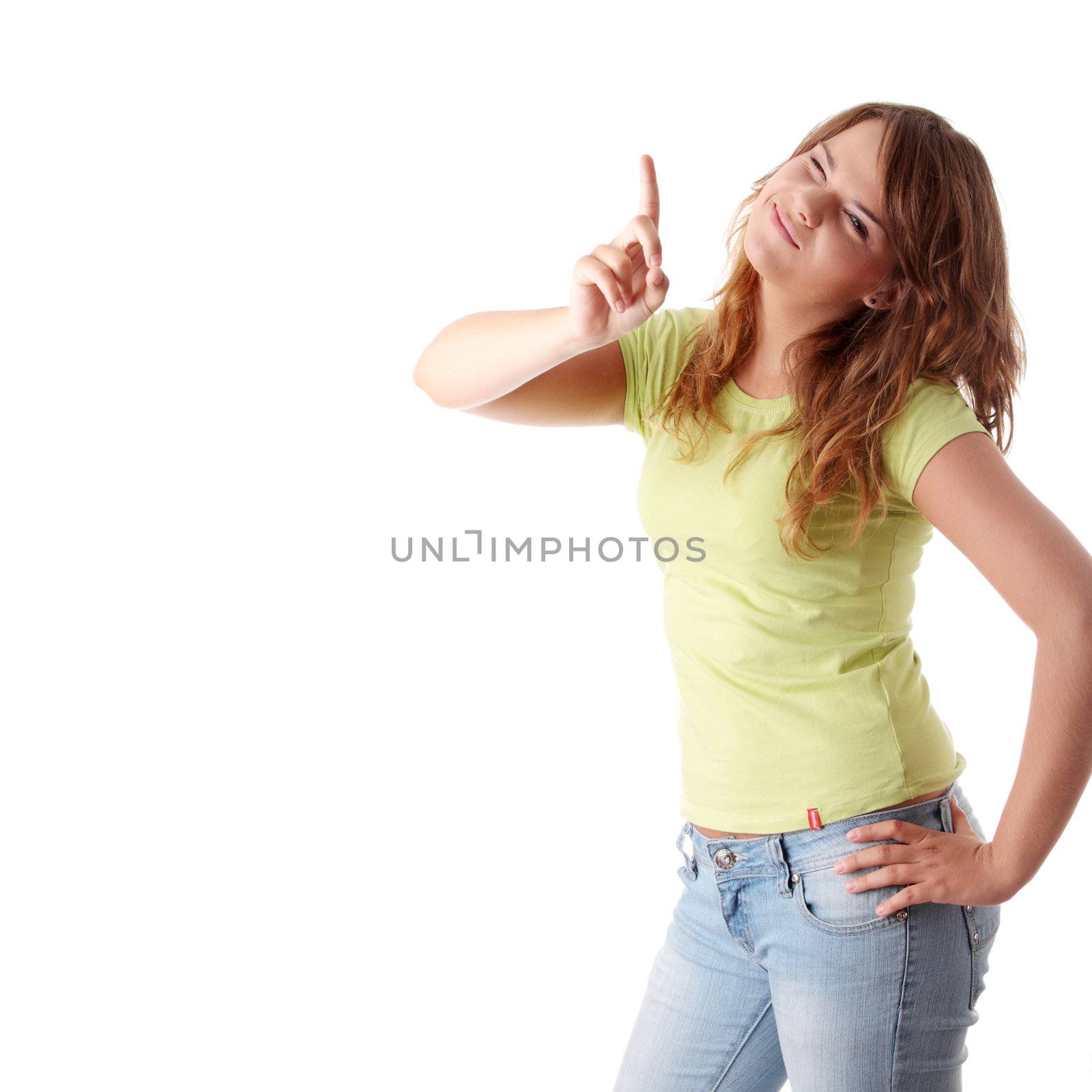 Young and beautiful female pointing at something up isolated on white