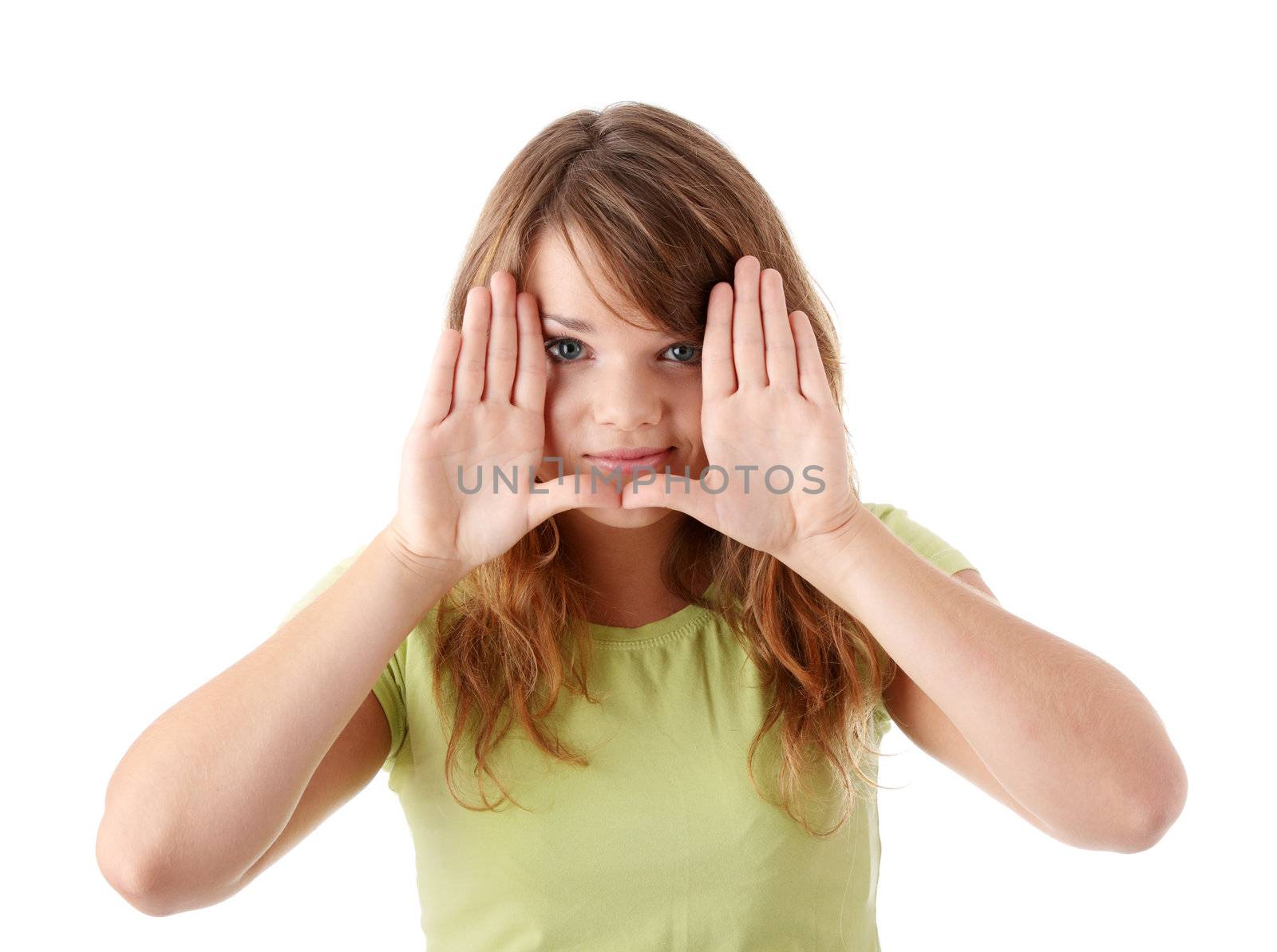 Closeup of beautiful young teenage woman making frame with her hands