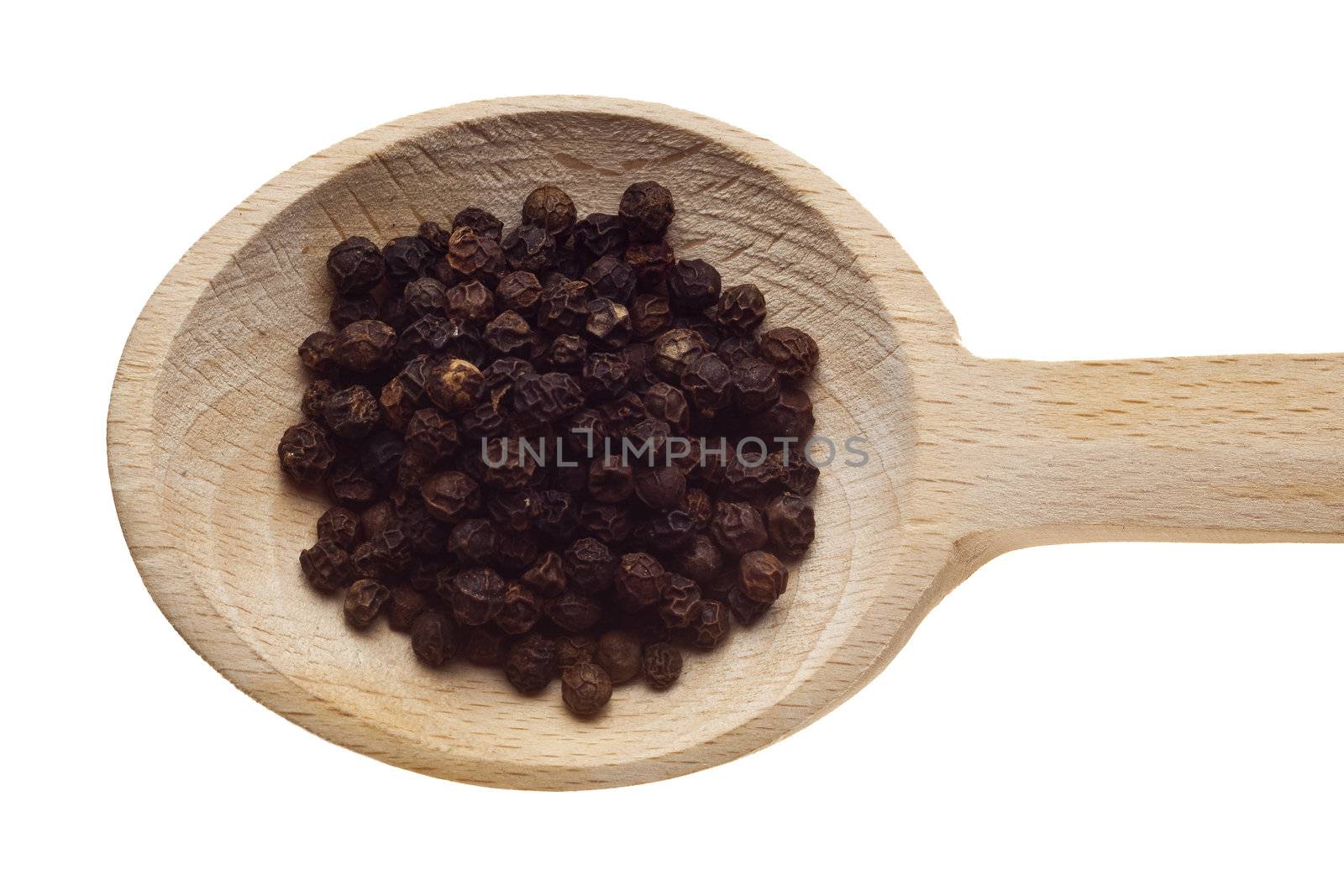 Herbs and spices on wooden spoons - pepper