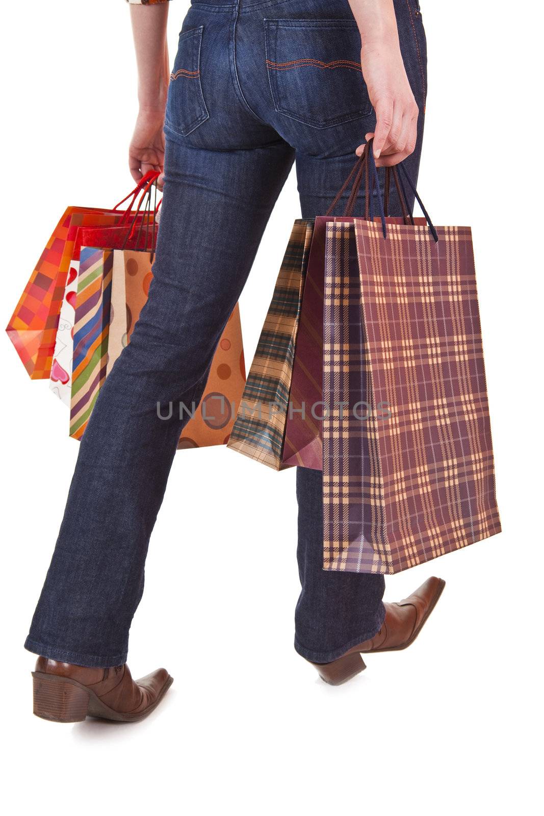 Happy woman holding shopping bags by adamr