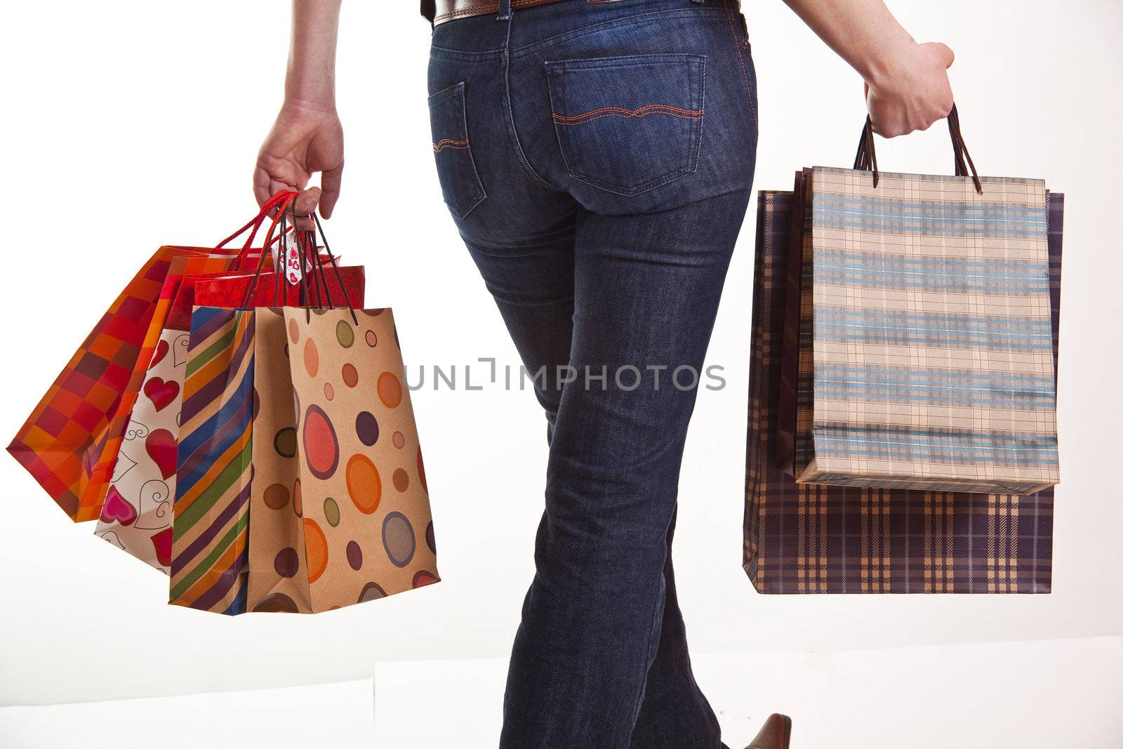 Shoppers Happiness - Woman's hand with shopping bags