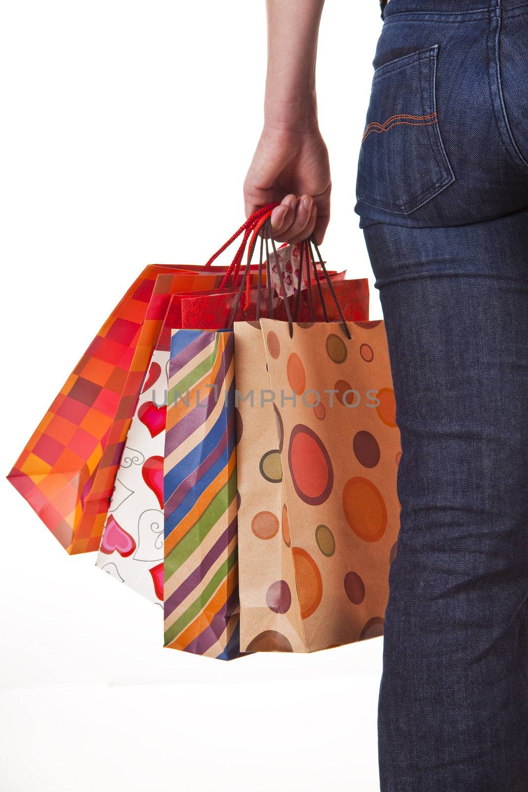 Shoppers Happiness - Woman's hand with shopping bags