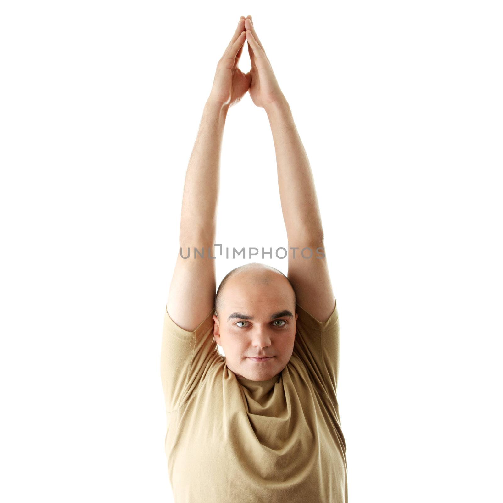 Man is making yoga in casual clothes isolated on white