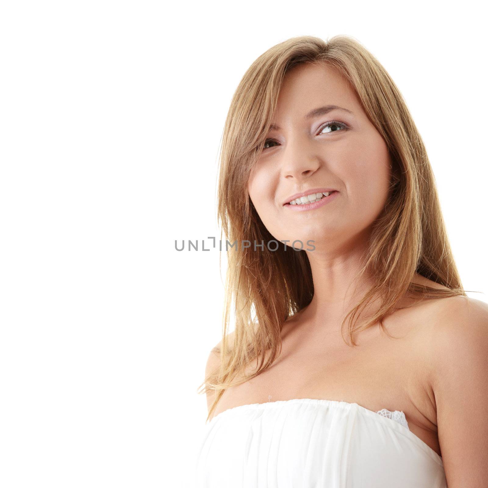 Portrait of beautiful girl model in white dress with fluttering hair and dress