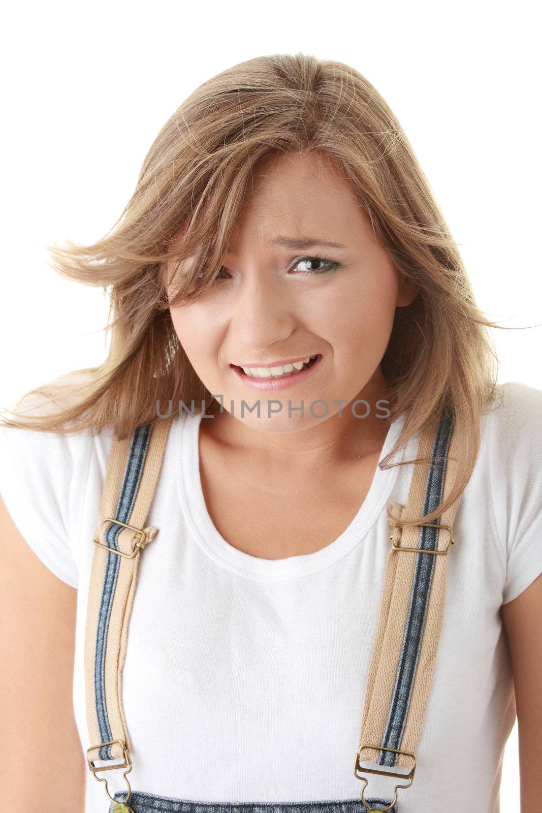 Surprised young woman with wild hair.