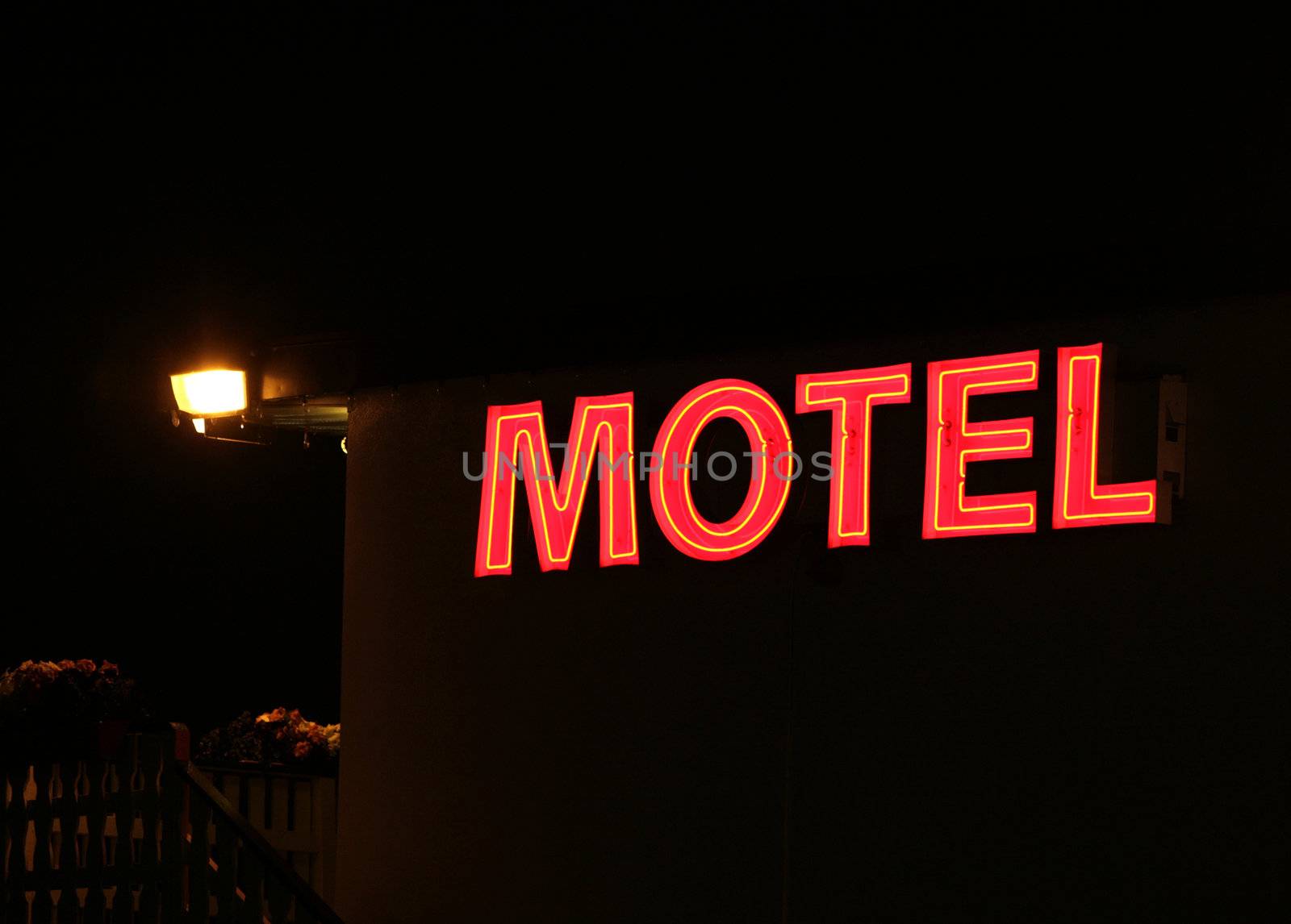 red motel sign at night 