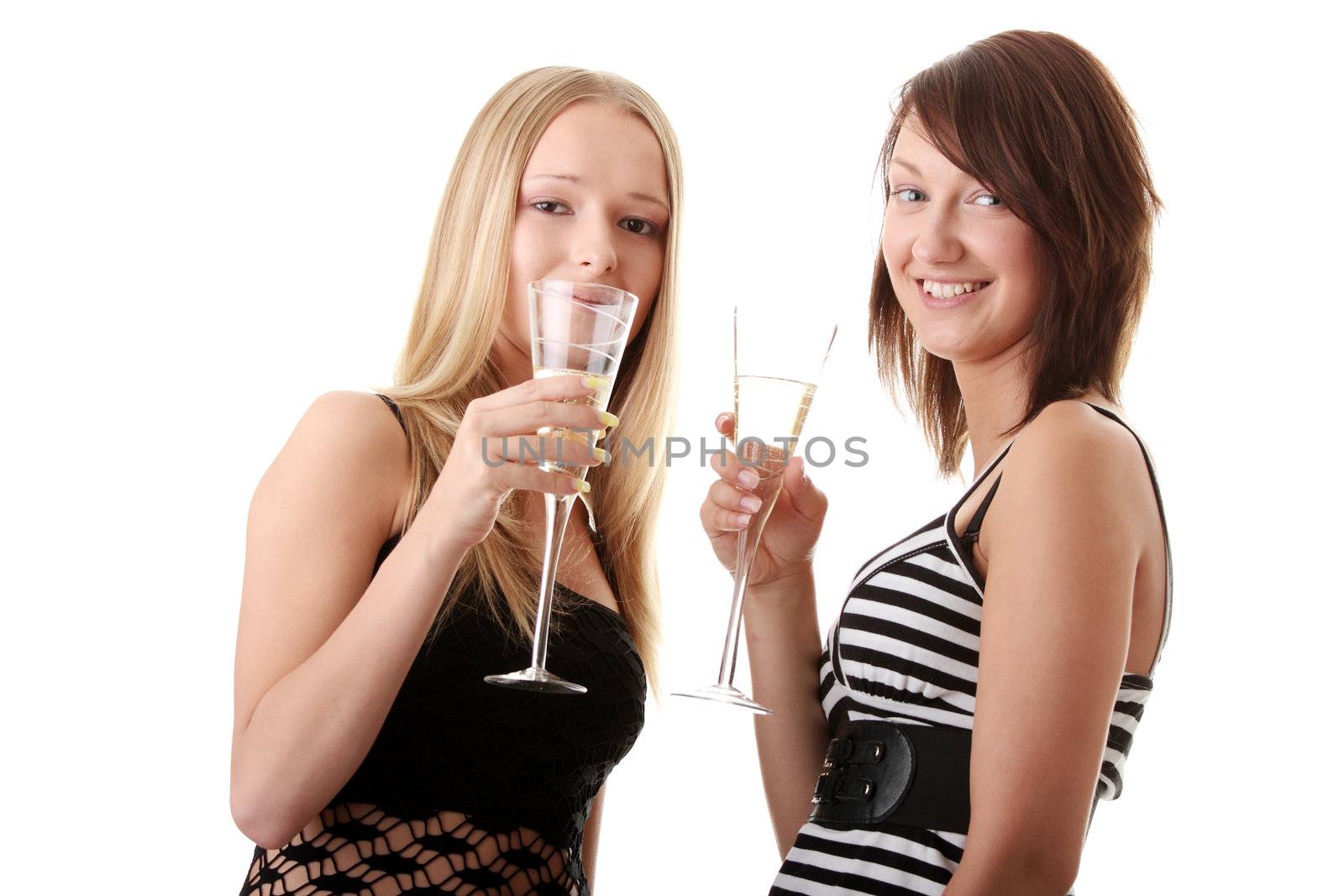 Two casual young women enjoying champagne isolated on white background