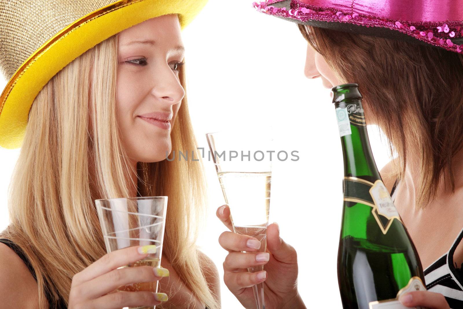 Two casual young women enjoying champagne by BDS
