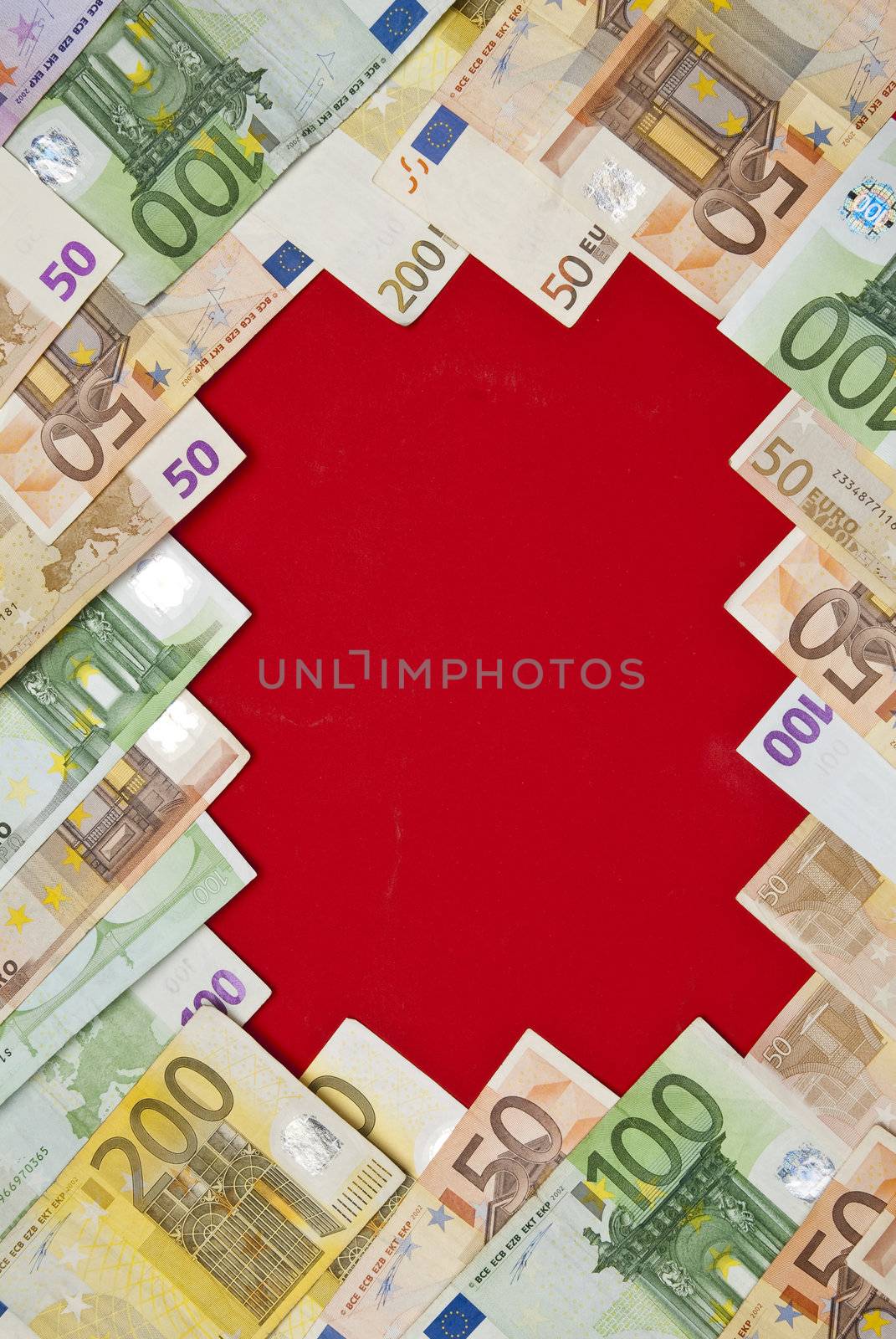 Euro bills on red background,recorded above them.