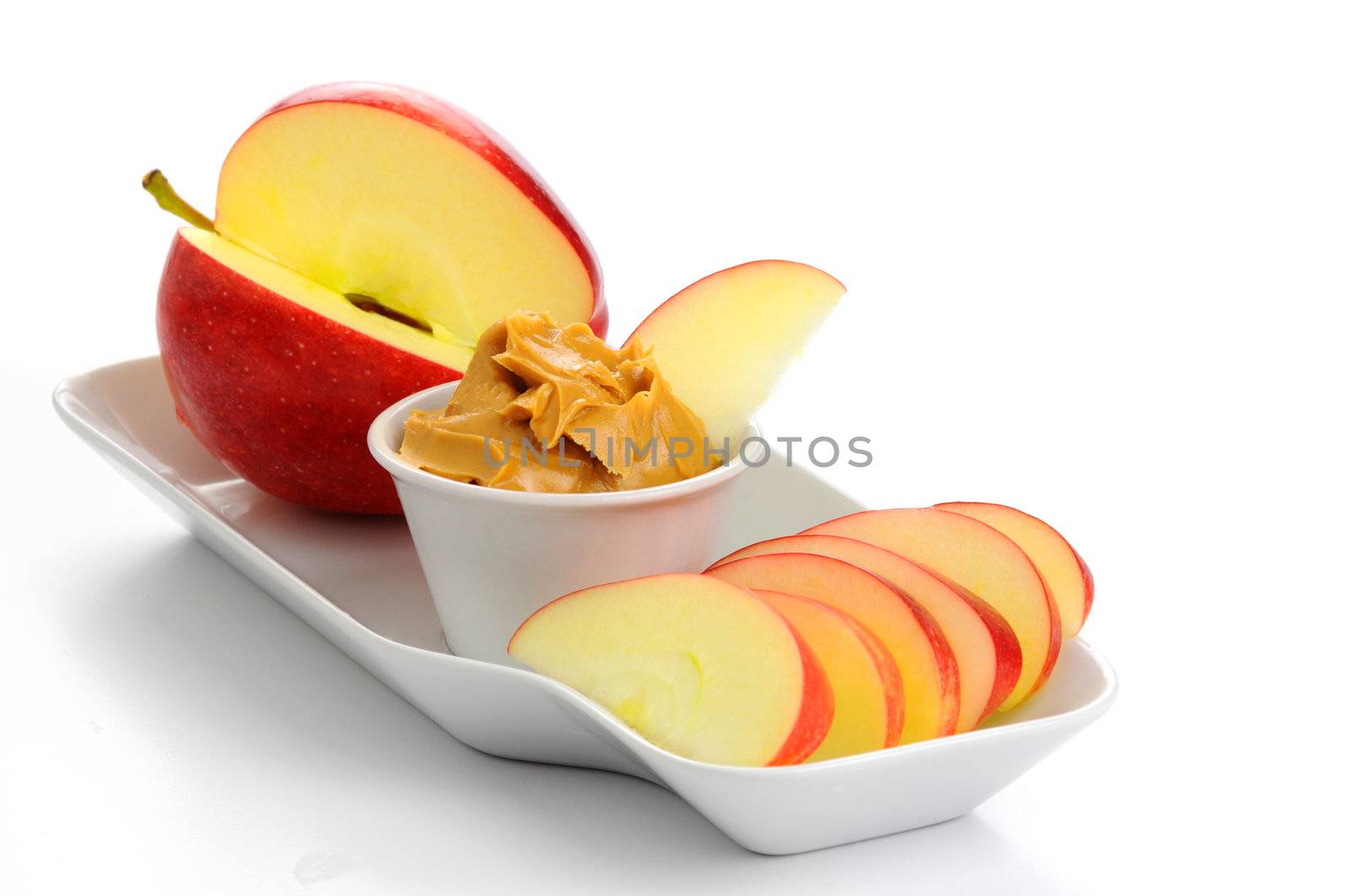 Snack consisting of ripe apple and peanut butter.