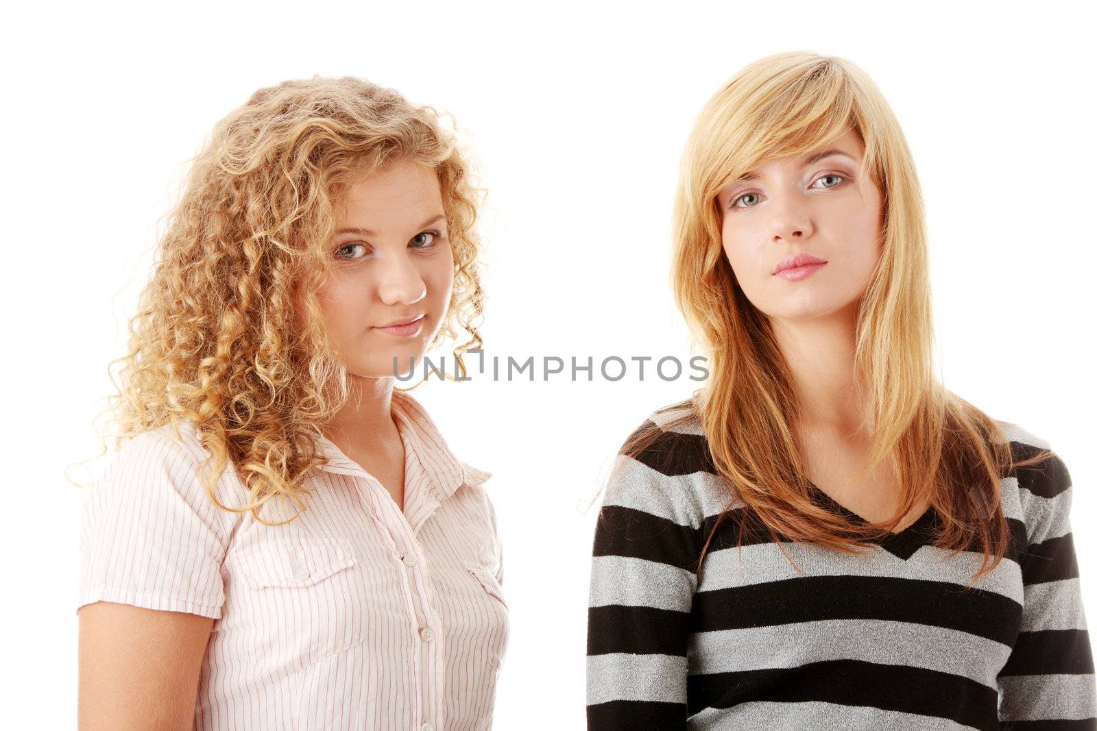 Two beautiful blond teen girlfriends isolated on white background