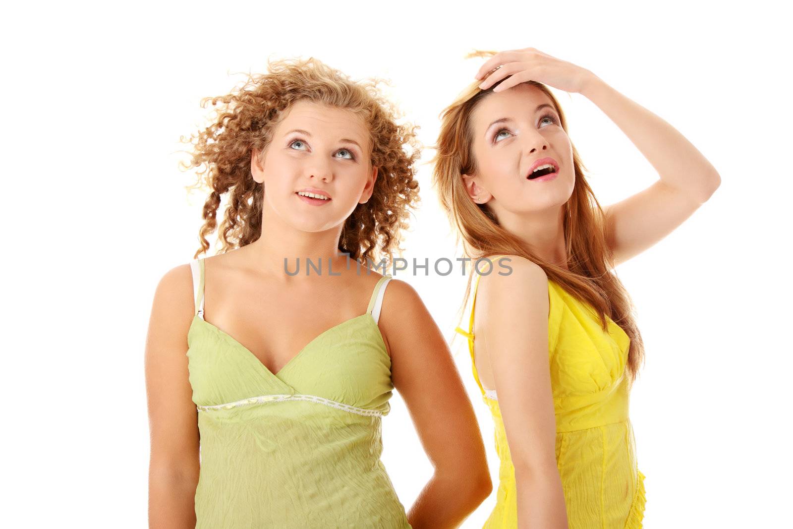 Two teen girlfriends isolated on white background