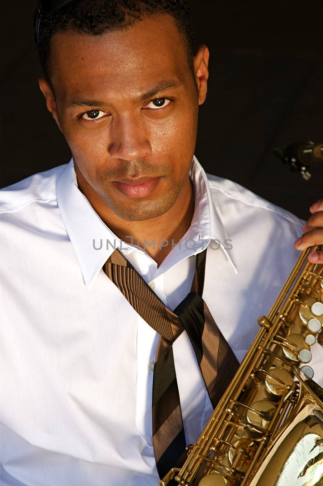 An youung and trendy African-American sax musician