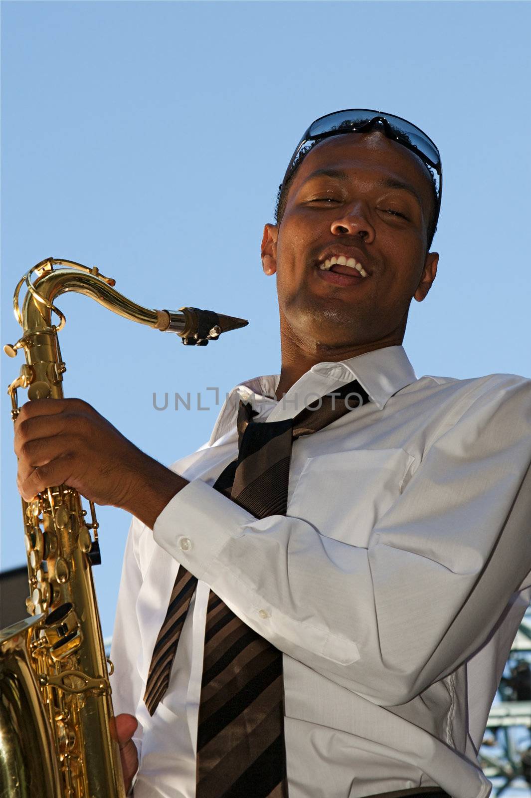 An youung and trendy African-American sax musician