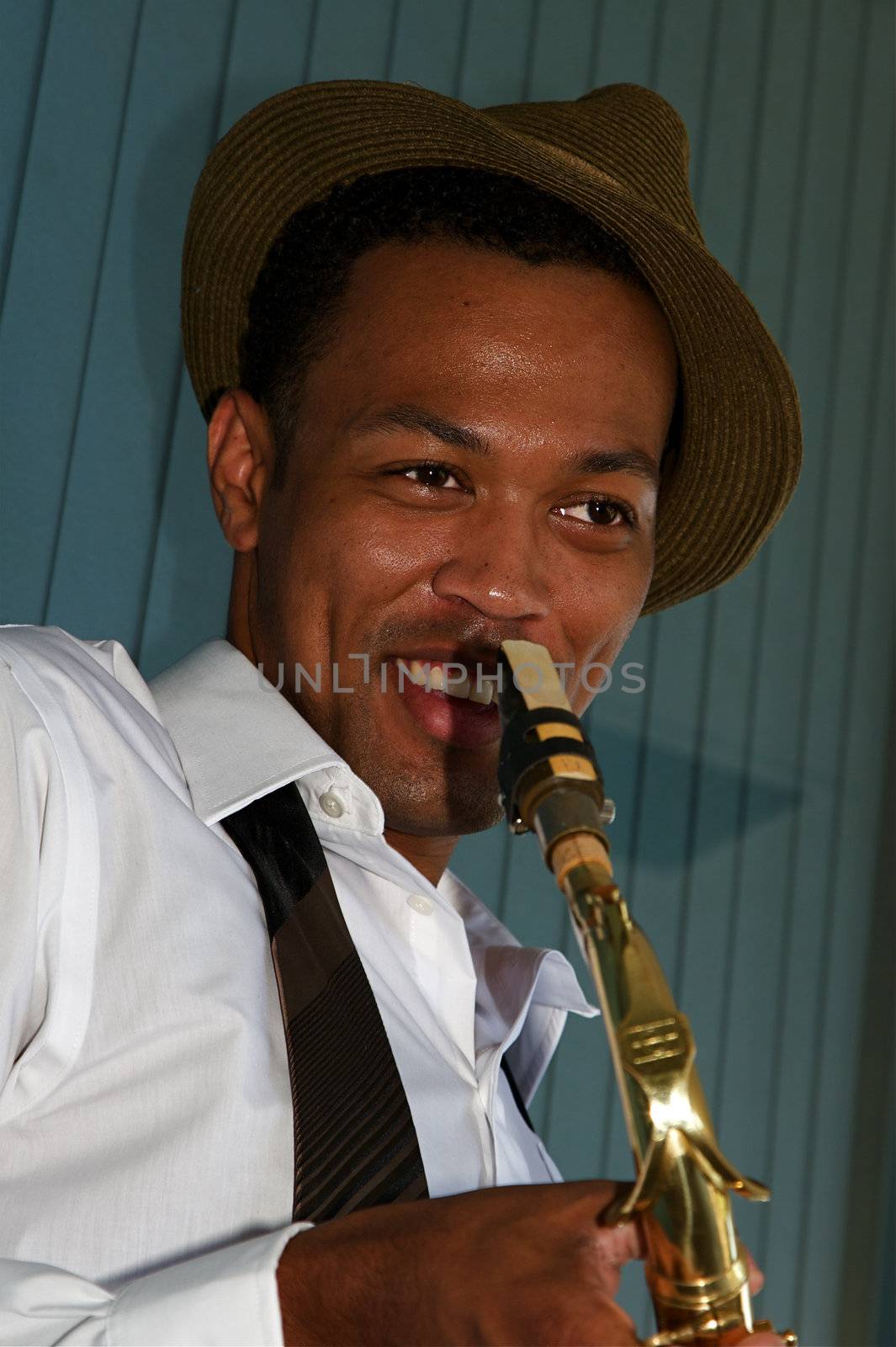 An youung and trendy African-American sax musician