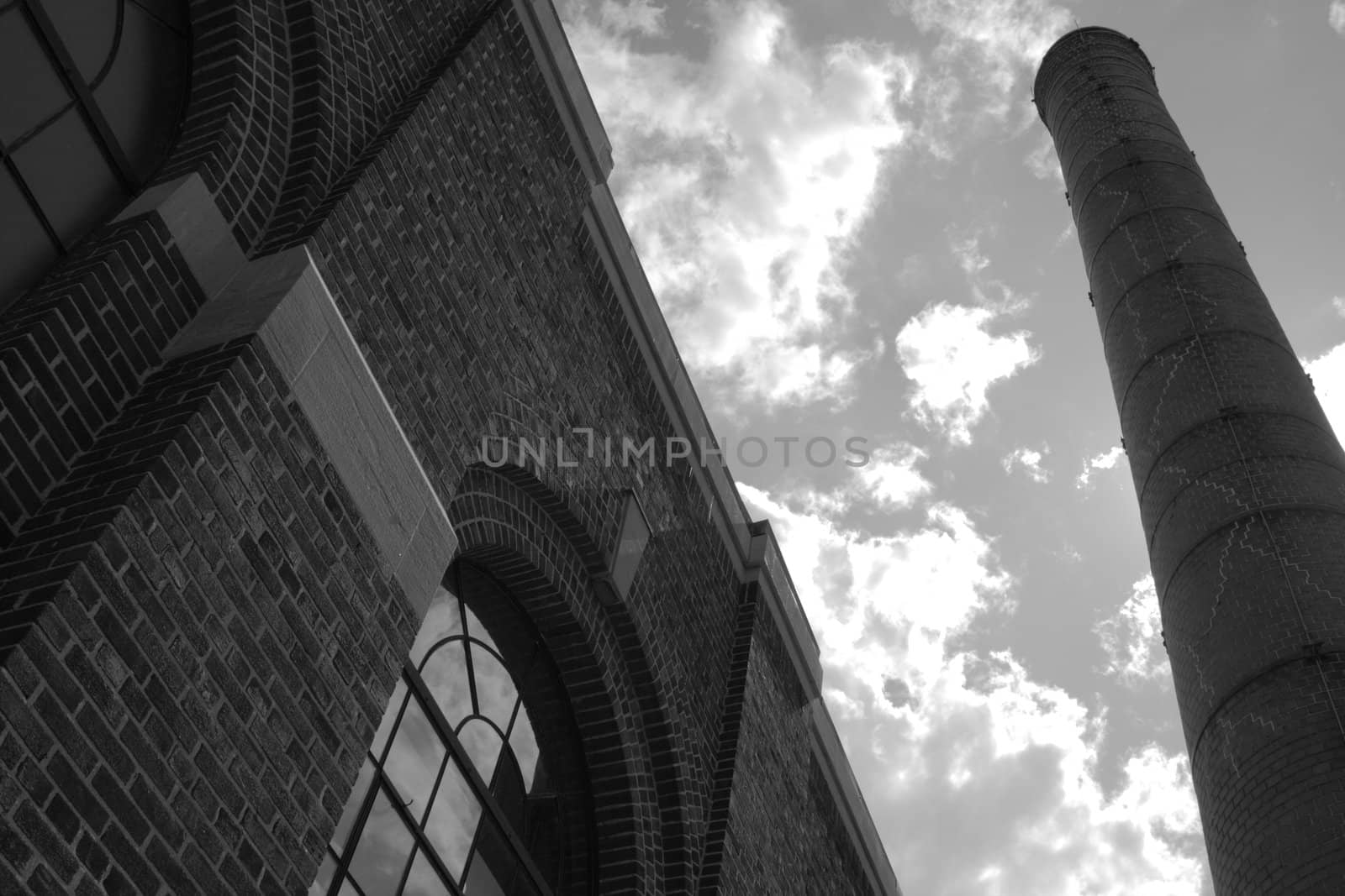 building and smoke stack architecture detail against sky